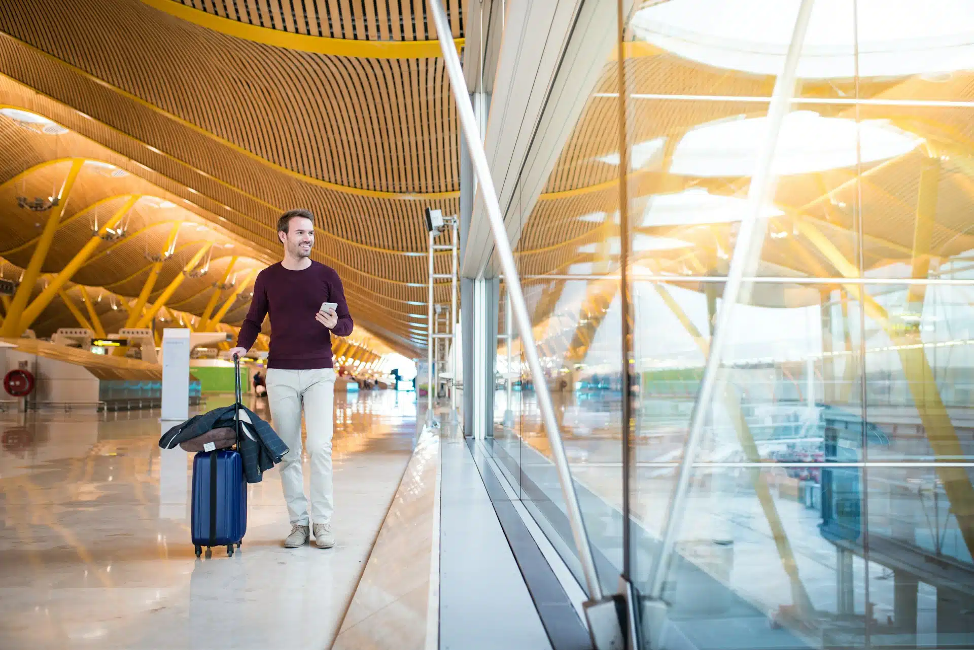 Chauffeur assisting a traveller with luggage at the airport